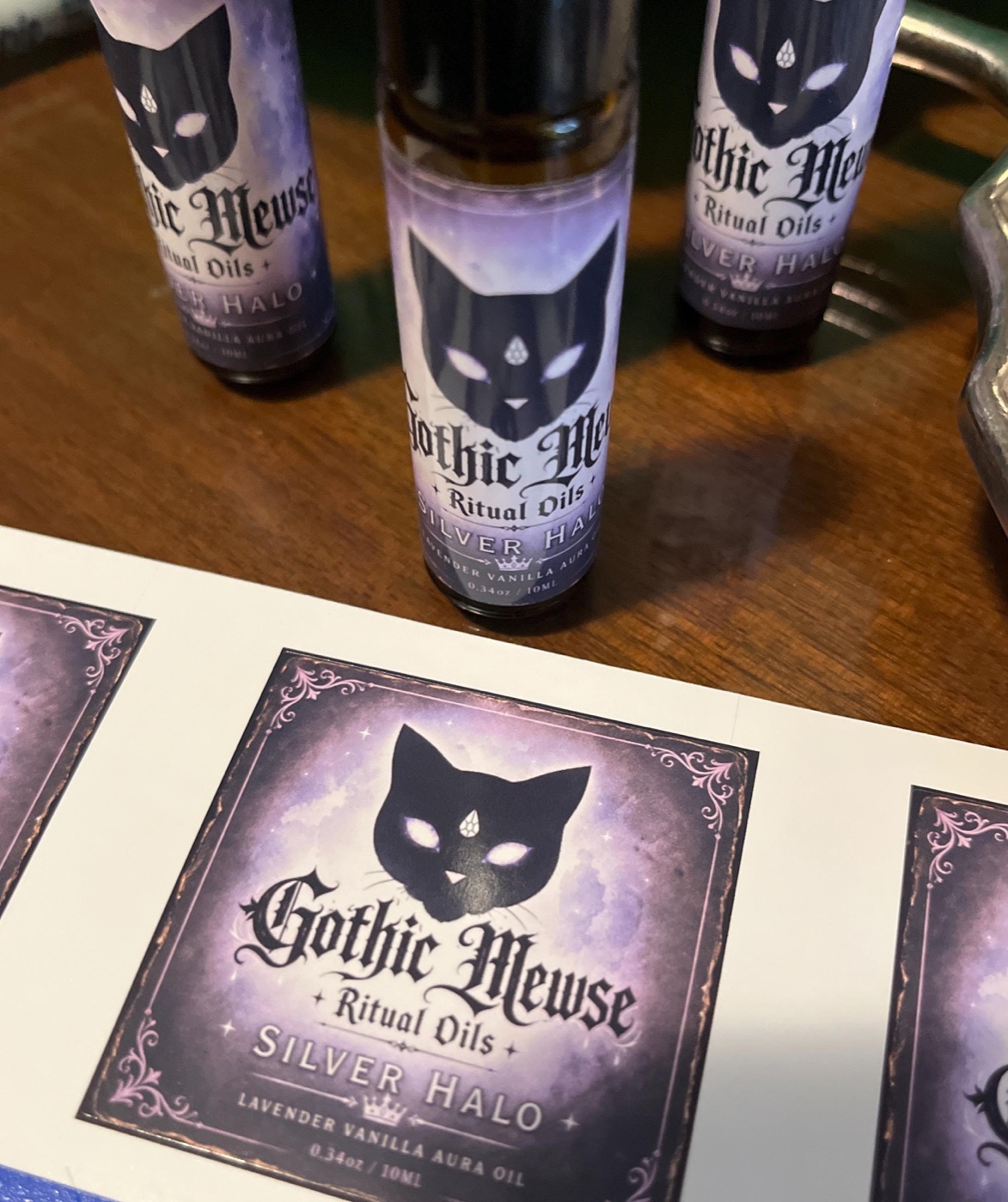 Three bottles of Silver Halo with matching square stickers
